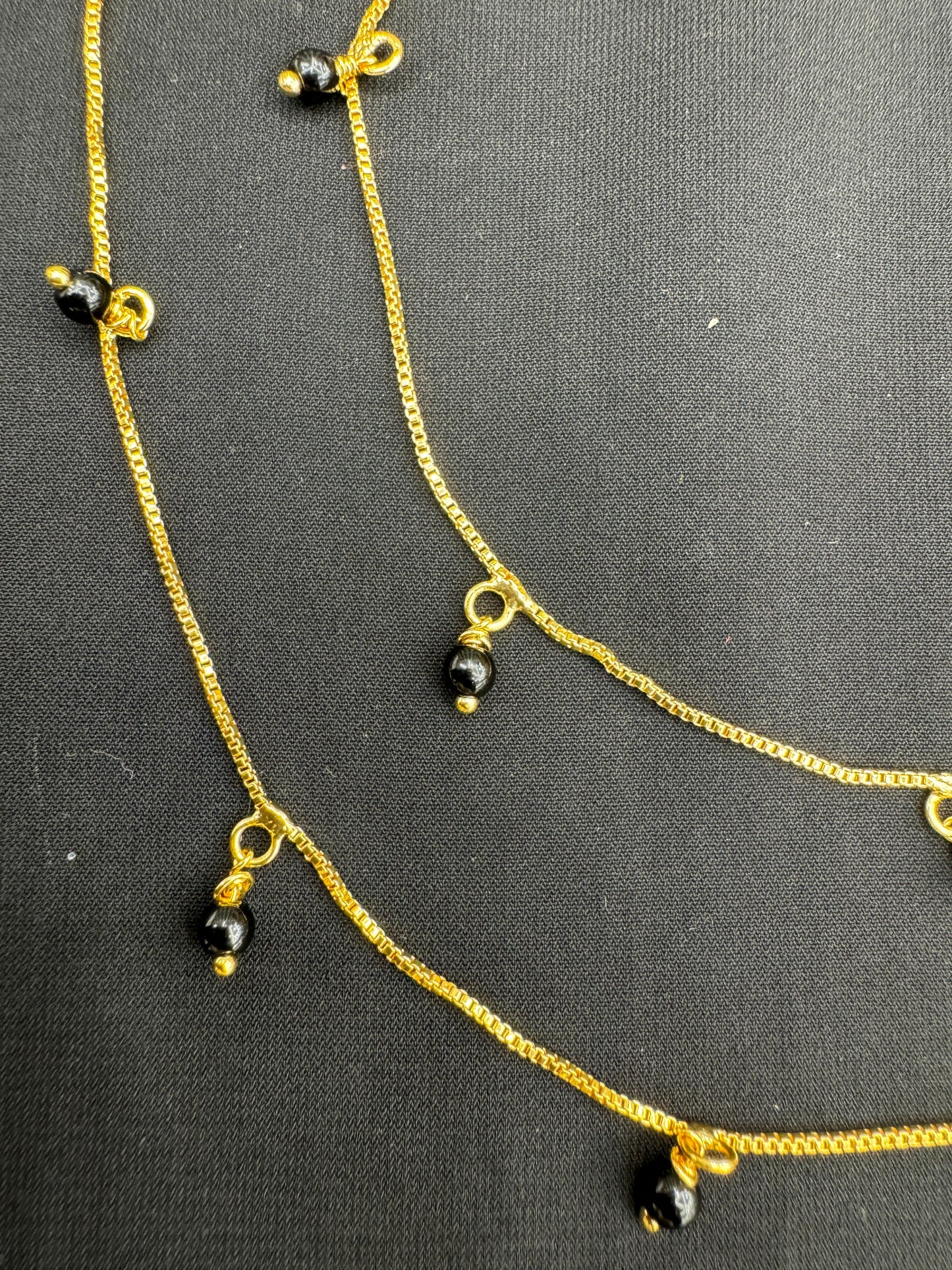 Elegant Gold With Black Beads Anklet" Product code - 6302