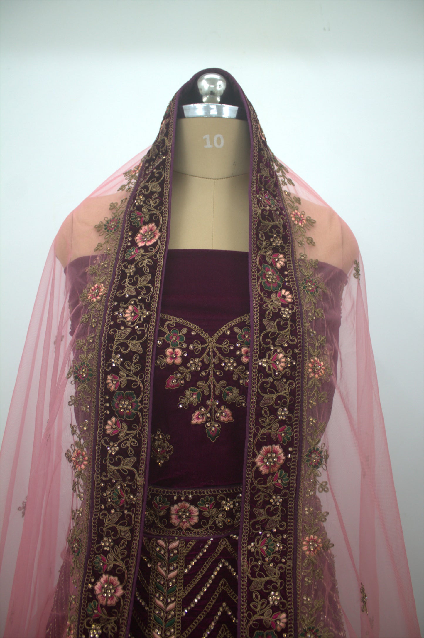 “Plum Velvet Bridal Lehenga with Intricate Floral Embroidery & Net Dupatta” Product code-1310