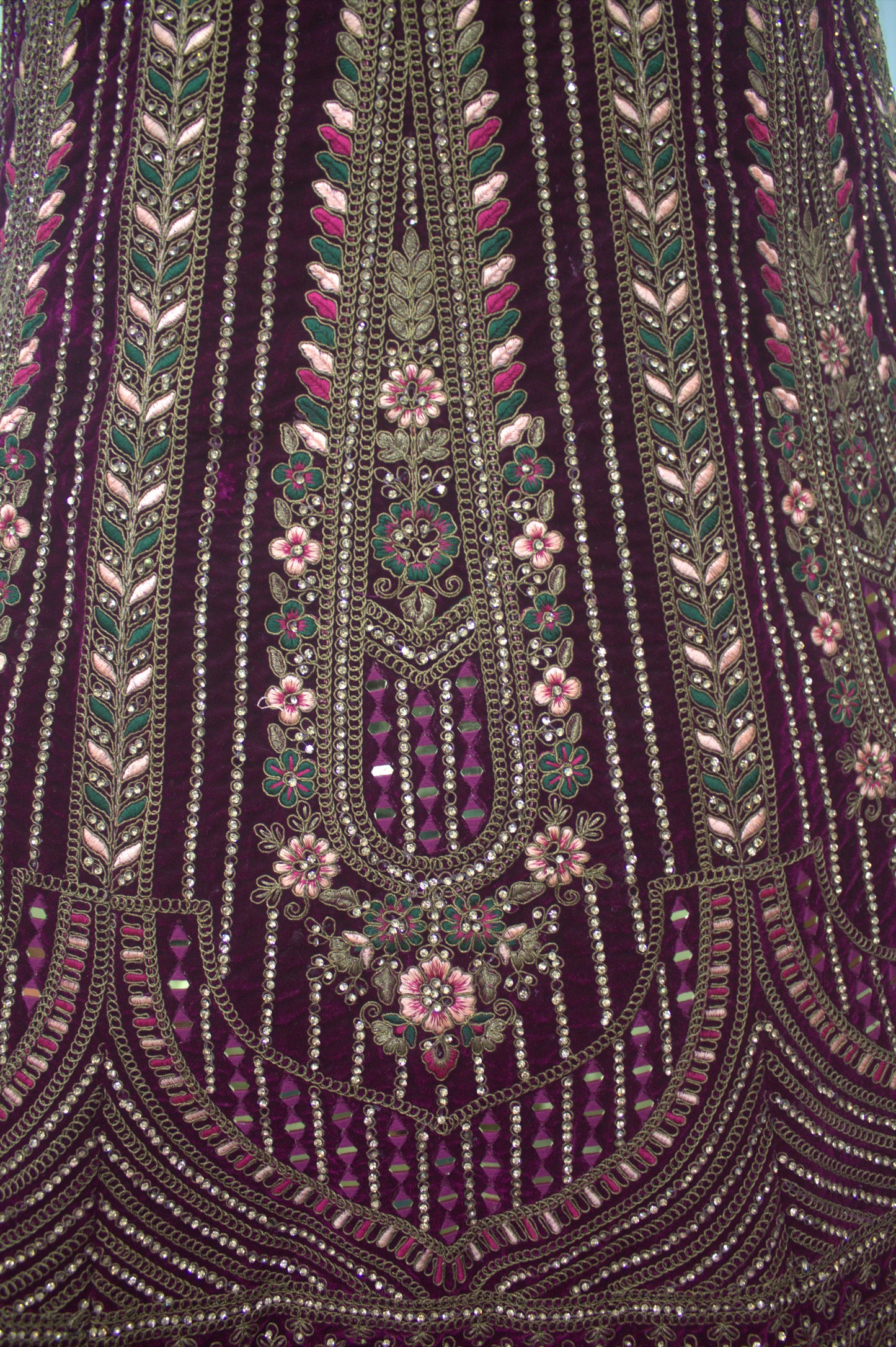 “Plum Velvet Bridal Lehenga with Intricate Floral Embroidery & Net Dupatta” Product code-1310