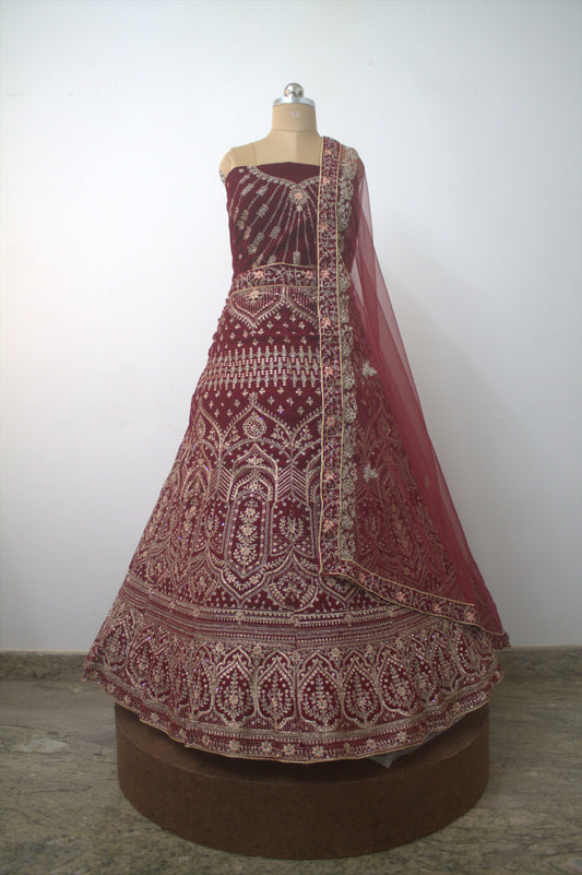 "Exquisite Maroon Bridal Lehenga Choli with Intricate Gold Embroidery – Traditional Indian Wedding Wear with Elegant Net Dupatta" Product code-1328