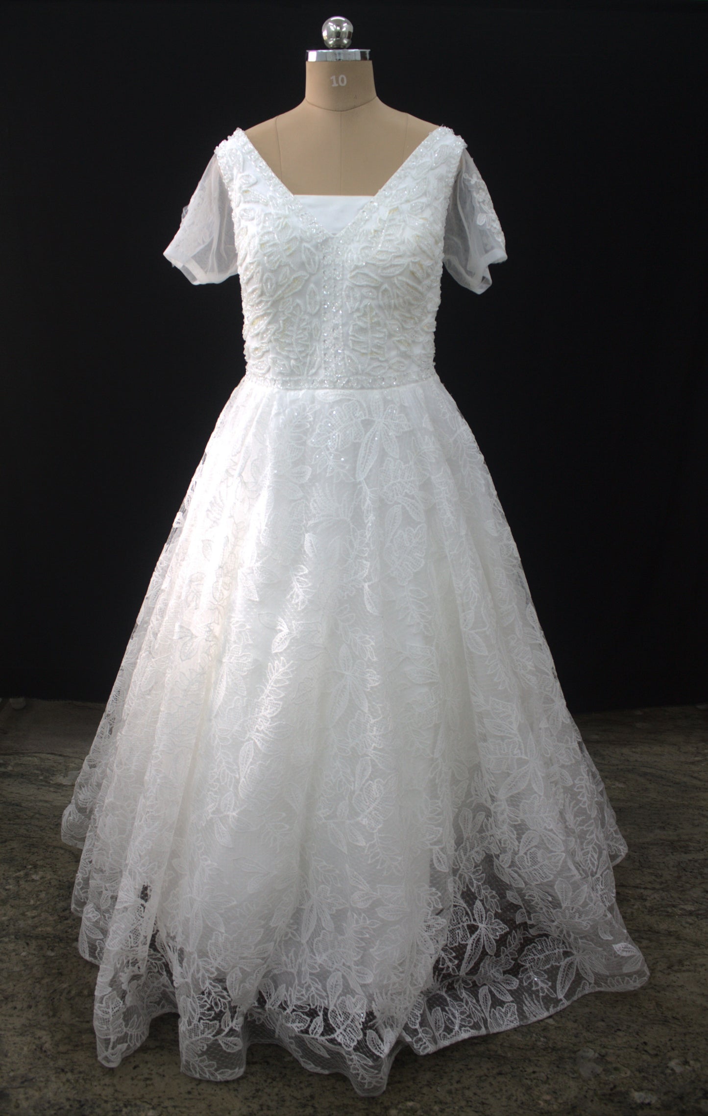 "Liora Elegant A-Line Lace Wedding Gown with Floral Embroidery & Sheer Short Sleeves-White Gown" Product code-2013