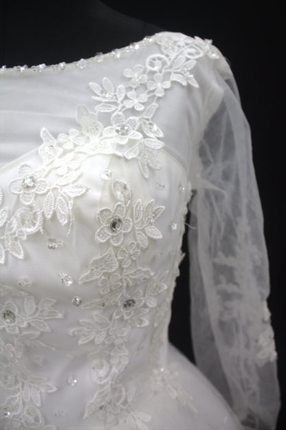 “Celeste Elegant Long Sleeve Ball Gown Wedding Dress with Lace Appliqués & Illusion Neckline-White Gown” Product code-2099
